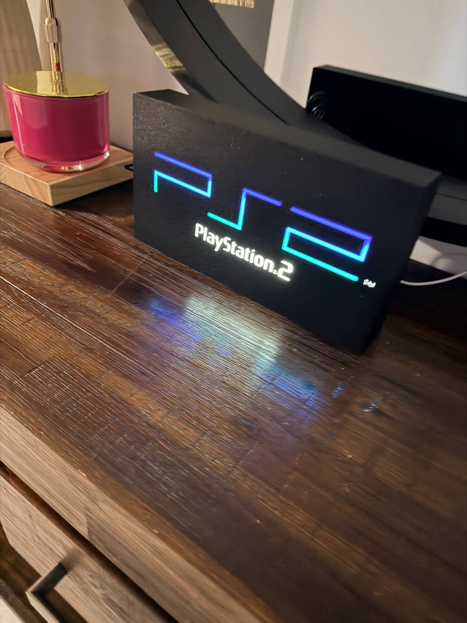 Sony PlayStation 2 LED light-up sign (full logo) on a desk, original PS2 colours