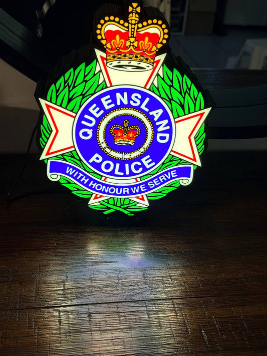 Queensland Police Service LED light-up sign on a wall