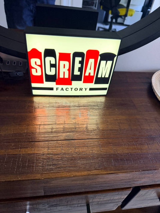 Scream Factory LED light-up sign glowing on a wall