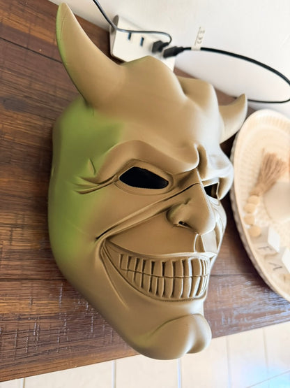 The Grabber mask side profile view - detailed sculpting with menacing grin
