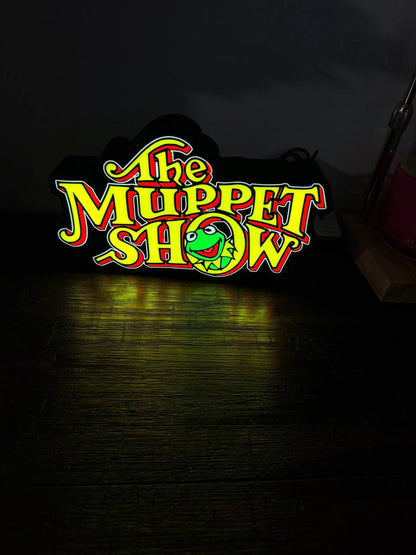 The Muppet Show LED sign illuminated with Kermit in the O — dramatic glow