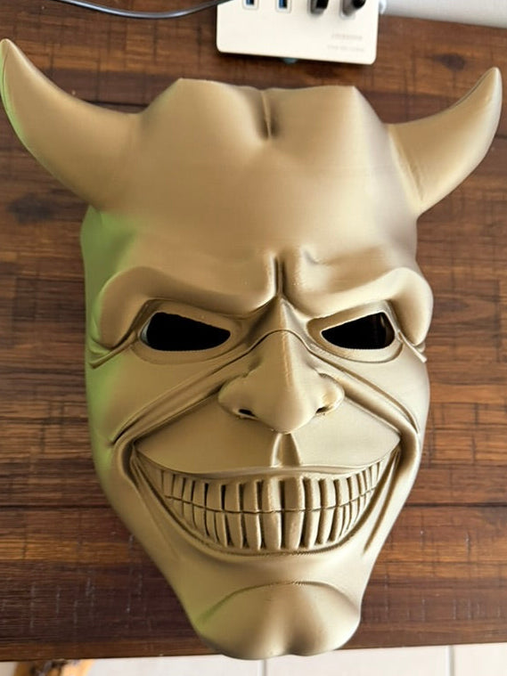 The Grabber mask overhead view - complete devil mask with horns and teeth details